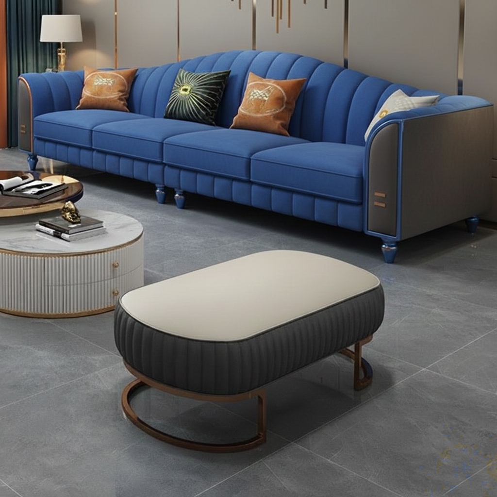 Royal blue luxury sofa with gold accents and plush cushions in a modern living room interior.