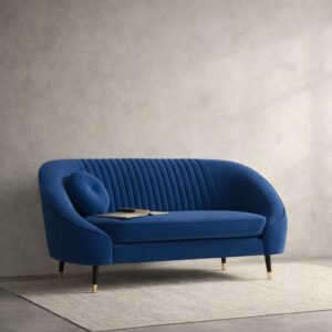 Royal blue velvet curved sofa with channel-tuffed backrest and gold-tipped legs