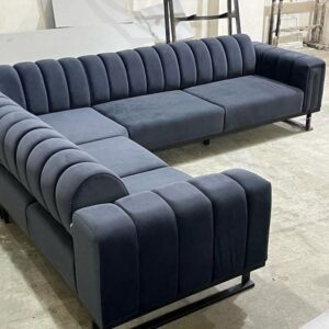Veltris Channel-Tufted Corner Sofa in midnight blue velvet by Turtle Vine Interiors