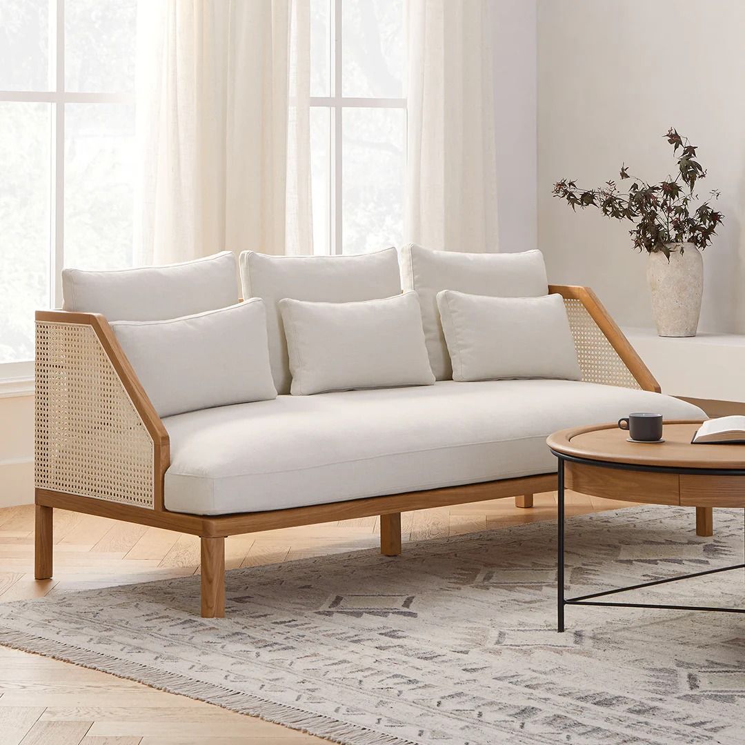 Elara Cane-Side Sofa with natural wood frame and cane panels by Turtle Vine Interiors