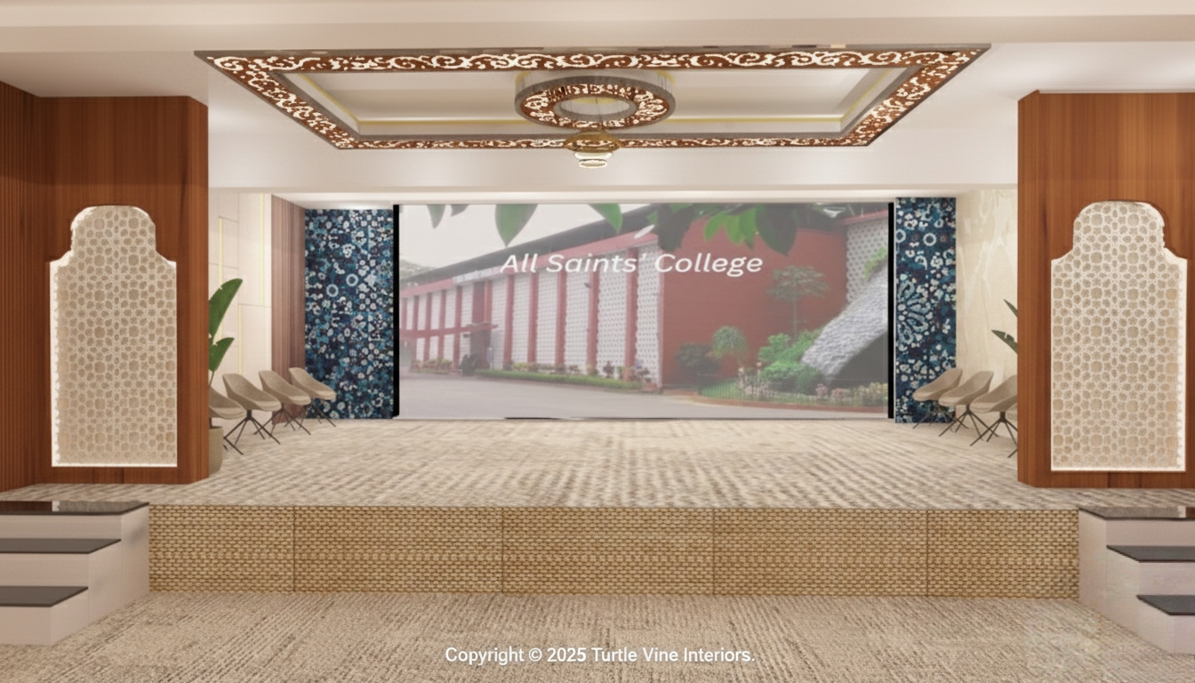 Spacious auditorium stage with decorative side panels, patterned ceiling design, and large digital projection screen.