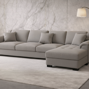 “Light grey L-shaped sectional sofa with cozy blankets and neutral décor in a softly lit living room.”